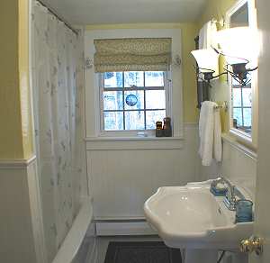 Bathroom with tub shower and sink